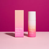 Skincare product with pink and white design on a pink background