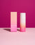 Skincare product with pink and white design on a pink background